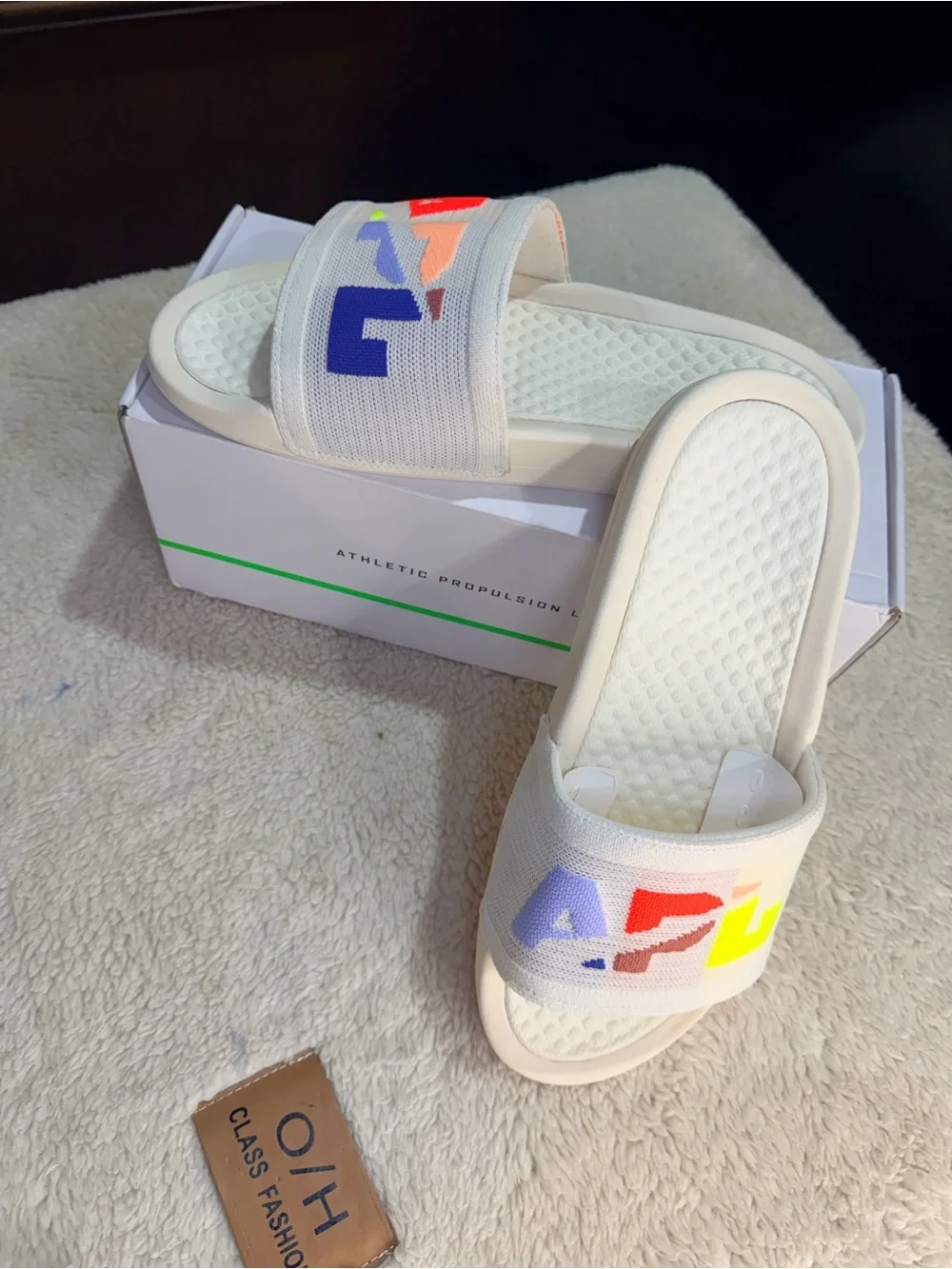 986. NIB SIZE M/9-W/10.5 APL Cream Slide Sandals with Multicolor Logo Accents
